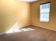 Bright bedroom with carpeted floor and large window at 1133 Spalding Ct., Surfside Beach, SC 29575