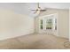 Spacious bedroom showcasing natural light and vaulted ceiling with fan at 1133 Spalding Ct., Surfside Beach, SC 29575