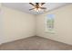 Bedroom featuring carpeted floors, a ceiling fan, and a window offering a view of the outdoors at 1133 Spalding Ct., Surfside Beach, SC 29575
