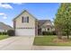 Charming home featuring a two-car garage, manicured lawn and neutral paint scheme at 1133 Spalding Ct., Surfside Beach, SC 29575