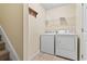 Laundry area with washer, dryer, and shelving at 1133 Spalding Ct., Surfside Beach, SC 29575