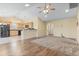 Open floor plan with hardwood floors leading to the kitchen and carpet in the living area at 1133 Spalding Ct., Surfside Beach, SC 29575