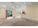 Open floor plan with hardwood floors, carpet, and access to a screened-in porch at 1133 Spalding Ct., Surfside Beach, SC 29575