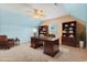 Home office with built-in bookcases, a large desk, a leather chair, and a bright window at 1133 Spalding Ct., Surfside Beach, SC 29575