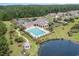 Aerial view of community pool with lounge chairs and landscaping at 1133 Spalding Ct., Surfside Beach, SC 29575