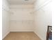 An empty walk-in closet with wire shelving and neutral carpeting, offering ample storage space at 1133 Spalding Ct., Surfside Beach, SC 29575