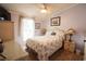 Bright bedroom with floral bedding and wicker furniture at 2780 Oak St., Conway, SC 29526