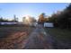 Long gravel driveway, white fence, sunny day at 2780 Oak St., Conway, SC 29526