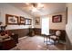 Spacious home office with a chair and framed artwork at 2780 Oak St., Conway, SC 29526
