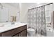 Clean bathroom with a vanity sink, a decorative shower curtain, and modern fixtures at 3126 White Jasmine Dr., Little River, SC 29566