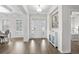 Inviting foyer with hardwood floors, stylish decor, and access to a bright, airy bedroom at 3126 White Jasmine Dr., Little River, SC 29566