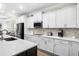 Well-equipped kitchen with modern appliances, herringbone backsplash, and ample counter space at 3126 White Jasmine Dr., Little River, SC 29566