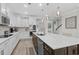 Modern kitchen with a large island, stainless steel appliances, and open layout to other living spaces at 3126 White Jasmine Dr., Little River, SC 29566
