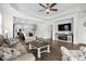 Spacious living room with an open floor plan, hardwood floors, and seamless flow to the modern kitchen at 3126 White Jasmine Dr., Little River, SC 29566