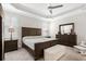 Comfortable main bedroom with a ceiling fan, tray ceiling, and neutral décor for a relaxing atmosphere at 3126 White Jasmine Dr., Little River, SC 29566