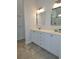 Bathroom features dual sinks and vanities, framed mirrors, and modern fixtures at 64 Summerlight Dr., Murrells Inlet, SC 29576