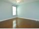 Well-lit bedroom with a large window, beautiful flooring, and a ceiling fan at 64 Summerlight Dr., Murrells Inlet, SC 29576
