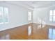 Bright bedroom featuring natural lighting, plantation shutters, and tray ceilings with a ceiling fan at 64 Summerlight Dr., Murrells Inlet, SC 29576