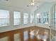 Bright living room with vaulted ceilings and many windows bringing in natural light at 64 Summerlight Dr., Murrells Inlet, SC 29576