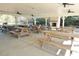 Spacious pavilion interior featuring picnic tables, ceiling fans and a brick fireplace at 64 Summerlight Dr., Murrells Inlet, SC 29576
