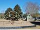 Community playground with various play structures for children of all ages set on a soft wood-chip surface at 64 Summerlight Dr., Murrells Inlet, SC 29576