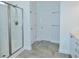 Bathroom features a modern glass shower with white tiles, brushed nickel fixtures, and a built-in bench at 64 Summerlight Dr., Murrells Inlet, SC 29576