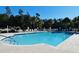 Community pool featuring sparkling blue water, ample lounge chairs, and well-maintained surrounding deck at 64 Summerlight Dr., Murrells Inlet, SC 29576