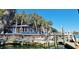 Waterfront restaurant with dock access, palm trees, and beautiful waterfront views at 64 Summerlight Dr., Murrells Inlet, SC 29576