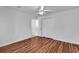 Bright bedroom featuring hardwood floors, a ceiling fan, and closet space at 784 Riverward Dr., Myrtle Beach, SC 29588