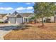 Charming home with a manicured lawn, attached two-car garage, and tasteful brick accents at 784 Riverward Dr., Myrtle Beach, SC 29588