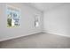 Spacious bedroom featuring neutral walls, carpet and bright windows at 1217 Nw Calabash Station Blvd., Calabash, NC 28467