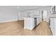 Stylish kitchen island with stainless steel appliances, and hardwood style flooring at 1217 Nw Calabash Station Blvd., Calabash, NC 28467