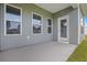 Covered patio showing the rear entrance into the house and view of the back yard at 1217 Nw Calabash Station Blvd., Calabash, NC 28467