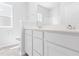 Bright bathroom boasts double vanity with white cabinets and modern fixtures, creating a spa-like atmosphere at 1233 Nw Calabash Station Blvd., Calabash, NC 28467