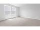Bedroom featuring two large windows that illuminate carpeted floors at 1233 Nw Calabash Station Blvd., Calabash, NC 28467