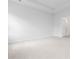 A bedroom with light carpet, with a ceiling fan, and a door to the bathroom at 1233 Nw Calabash Station Blvd., Calabash, NC 28467