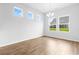 Bright dining area with a modern chandelier and large windows offering views of the backyard at 1233 Nw Calabash Station Blvd., Calabash, NC 28467