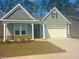 Charming one-story home features a two-car garage, landscaped front yard, and inviting front entrance at 1233 Nw Calabash Station Blvd., Calabash, NC 28467