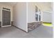 Inviting front porch with stone accents and a stylish front door, adding curb appeal at 1233 Nw Calabash Station Blvd., Calabash, NC 28467