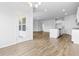 Open-concept kitchen with granite countertops, a center island, and stainless-steel appliances that flows into the living area at 1233 Nw Calabash Station Blvd., Calabash, NC 28467