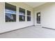 Covered patio with large windows and a door offers a seamless transition to outdoor living at 1233 Nw Calabash Station Blvd., Calabash, NC 28467