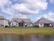 Residential backyard featuring pond and black aluminum fence at 3070 Sutherland Dr., Little River, SC 29566