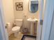 Cozy powder room with pedestal sink and decorative wall art at 3070 Sutherland Dr., Little River, SC 29566
