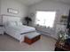 Bright bedroom with vaulted ceilings, a large window, and luxury vinyl plank flooring at 3070 Sutherland Dr., Little River, SC 29566