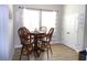 Bright dining area with wood table and chairs near window at 3070 Sutherland Dr., Little River, SC 29566