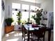 Bright dining room featuring a large window with natural light and stylish decor at 3070 Sutherland Dr., Little River, SC 29566