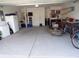 Spacious garage featuring ample storage space, room for multiple vehicles, and various tools and equipment at 3070 Sutherland Dr., Little River, SC 29566