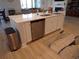Kitchen island with stainless steel dishwasher and sink with seating open to living room at 3070 Sutherland Dr., Little River, SC 29566