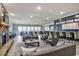 Lounge area featuring a stone fireplace, comfortable seating and a stylish bar for relaxation and social gatherings at 3070 Sutherland Dr., Little River, SC 29566