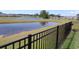 Scenic view of pond from fenced backyard at 3070 Sutherland Dr., Little River, SC 29566